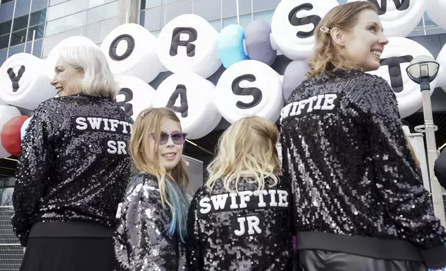 FILE - Fans of Taylor Swift, known as Swifties, pose for a photo as they gather outside Toronto's Rogers Centre to see Swift perform on Nov. 14, 2024. (Chris Young/The Canadian Press via AP, File)