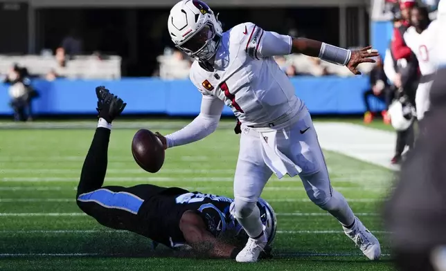 Arizona Cardinals quarterback Kyler Murray runs against the Carolina Panthers during the first half of an NFL football game, Sunday, Dec. 22, 2024, in Charlotte, N.C. (AP Photo/Rusty Jones)