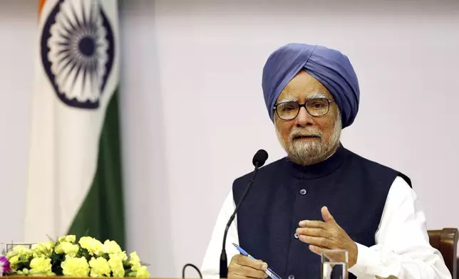 FILE - Indian Prime Minster Manmohan Singh addresses a press conference, in New Delhi, India, Friday, Jan. 3, 2014. (AP Photo/Harish Tyagi, Pool, File)