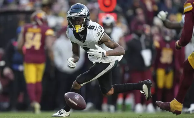 Philadelphia Eagles wide receiver DeVonta Smith (6) drops a pass during the second half of an NFL football game against the Washington Commanders, Sunday, Dec. 22, 2024, in Landover, Md. (AP Photo/Stephanie Scarbrough)