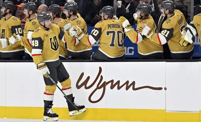 Vegas Golden Knights center Ivan Barbashev (49) celebrates after scoring against the Edmonton Oilers during the first period of an NHL hockey game, Tuesday, Dec. 3, 2024, in Las Vegas. (AP Photo/David Becker)