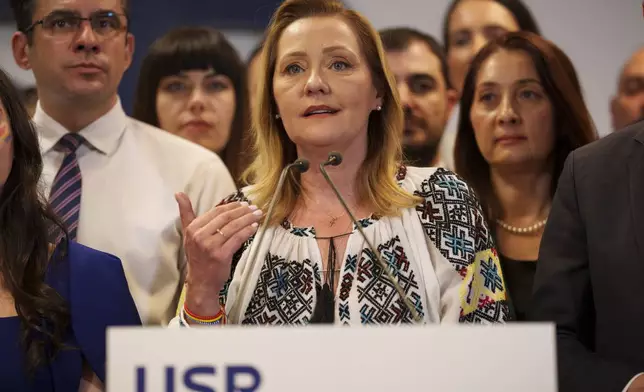 Elena Lasconi, runner up in the presidential runoff, representing the Save Romania Union, or USR, speaks after exit polls were published in the country's parliamentary elections, in Bucharest, Romania, Sunday, Dec. 1, 2024. (AP Photo/Vadim Ghirda)