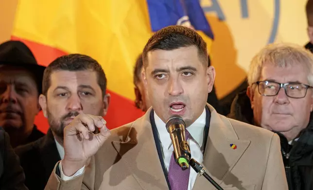 George Simion, leader of the Alliance for the Unity of Romanians (AUR) speaks to media after polls closed during the country's parliamentary elections, in Bucharest, Romania, Sunday, Dec. 1, 2024. (AP Photo/Andreea Alexandru)