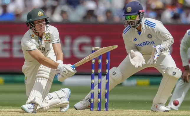 Australia's Marnus Labuschagne plays a sweep shot during play on the first day of the fourth cricket test between Australia and India at the Melbourne Cricket Ground, Melbourne, Australia, Thursday, Dec. 26, 2024. (AP Photo/Asanka Brendon Ratnayake)