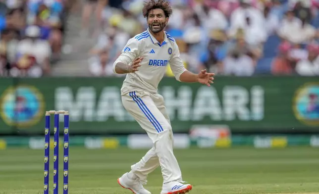 India's Ravindra Jadeja reacts after bowling a delivery during play on the first day of the fourth cricket test between Australia and India at the Melbourne Cricket Ground, Melbourne, Australia, Thursday, Dec. 26, 2024. (AP Photo/Asanka Brendon Ratnayake)