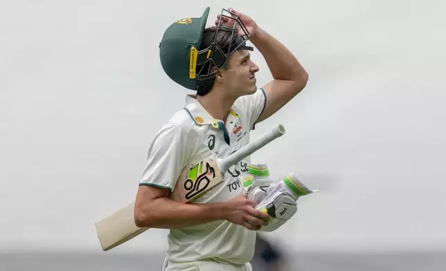 Australia's Sam Konstas walks off the field after losing his wicket during play on the first day of the fourth cricket test between Australia and India at the Melbourne Cricket Ground, Melbourne, Australia, Thursday, Dec. 26, 2024. (AP Photo/Asanka Brendon Ratnayake)