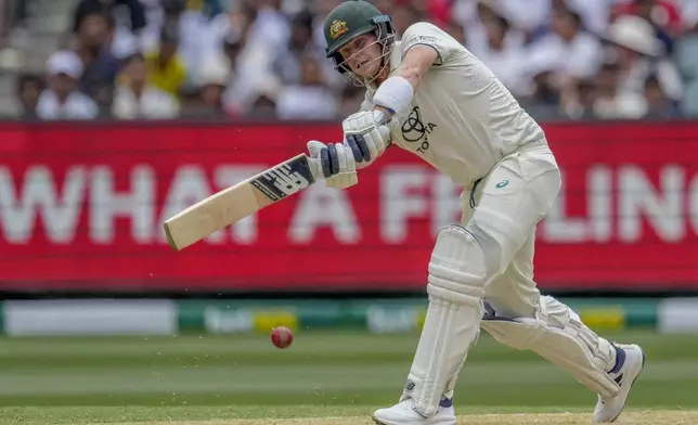 Australia's Steve Smith plays a shot during play on the first day of the fourth cricket test between Australia and India at the Melbourne Cricket Ground, Melbourne, Australia, Thursday, Dec. 26, 2024. (AP Photo/Asanka Brendon Ratnayake)