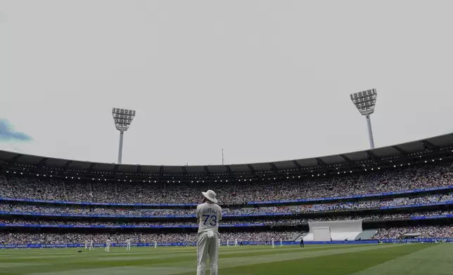 India's Mohammed Siraj stands at his fielding position near the boundary line during play on the first day of the fourth cricket test between Australia and India at the Melbourne Cricket Ground, Melbourne, Australia, Thursday, Dec. 26, 2024. (AP Photo/Asanka Brendon Ratnayake)