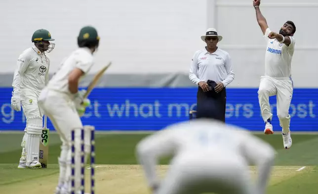 India's Jasprit Bumrah bowls to Australia's Sam Konstas during play on the first day of the fourth cricket test between Australia and India at the Melbourne Cricket Ground, Melbourne, Australia, Thursday, Dec. 26, 2024. (AP Photo/Asanka Brendon Ratnayake)