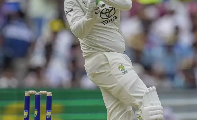 Australia's Usman Khawaja plays a shot during play on the first day of the fourth cricket test between Australia and India at the Melbourne Cricket Ground, Melbourne, Australia, Thursday, Dec. 26, 2024. (AP Photo/Asanka Brendon Ratnayake)