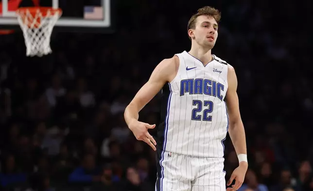 Orlando Magic forward Franz Wagner reacts after making a 3-point basket against the Brooklyn Nets during the first half of an Emirates NBA Cup basketball game, Friday, Nov. 29, 2024, in New York. (AP Photo/Noah K. Murray)