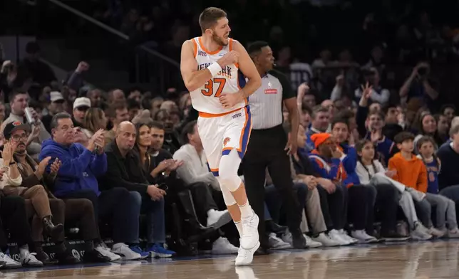 New York Knicks' Matt Ryan reacts after scoring a 3-point basket during the second half of an NBA basketball game against the New Orleans Pelicans, Sunday, Dec. 1, 2024, in New York. (AP Photo/Pamela Smith)