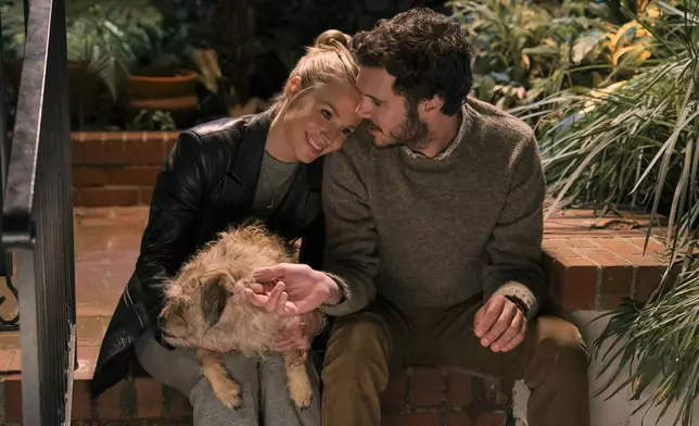 This image released by Netflix shows Kristen Bell, left, and Adam Brody in a scene from "Nobody Wants This." (Hopper Stone/Netflix via AP)