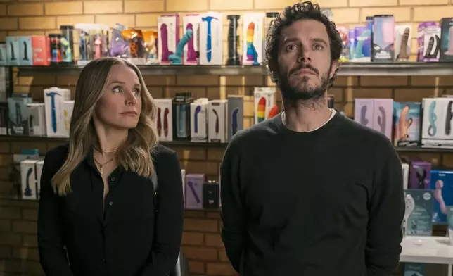 This image released by Netflix shows Kristen Bell, left, and Adam Brody in a scene from "Nobody Wants This." (Adam Rose/Netflix via AP)