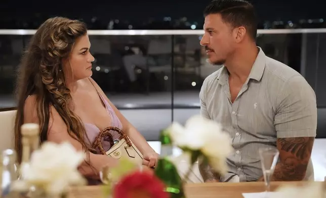 This image released by Bravo shows Brittany Cartwright, left, and Jax Taylor in a scene from the reality series "The Valley." (Casey Durkin/Bravo via AP)