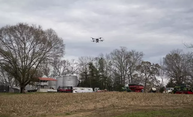 Russell Hedrick's DJI drone puts crop cover on his farm, Tuesday, Dec. 17, 2024, in Hickory, N.C. (AP Photo/Allison Joyce)