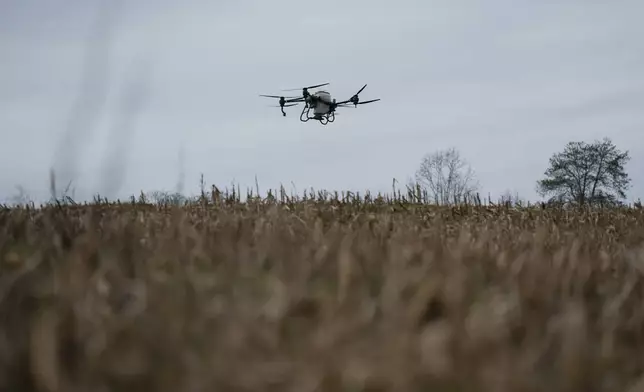 Russell Hedrick's DJI drone puts crop cover on his farm, Tuesday, Dec. 17, 2024, in Hickory, N.C. (AP Photo/Allison Joyce)