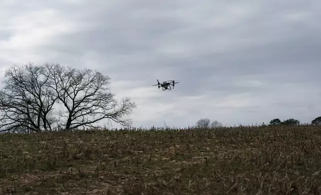 Russell Hedrick's DJI drone puts crop cover on his farm, Tuesday, Dec. 17, 2024, in Hickory, N.C. (AP Photo/Allison Joyce)