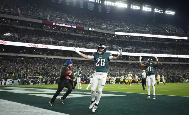 Philadelphia Eagles running back Will Shipley (28) gestures to the crowd with Eagles fullback Khari Blasingame (48) during the second half of an NFL football game against the Pittsburgh Steelers on Sunday, Dec. 15, 2024, in Philadelphia. (AP Photo/Matt Slocum)