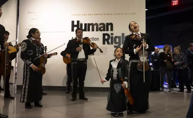 Altagracia Vazquez performs with her daughter Ariana, 6, and Mariachi Palmeros during a Chicanukah event at Holocaust Museum Houston on Thursday, December 19, 2024, in Houston. (AP Photo/Annie Mulligan)