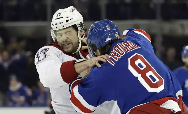 Montreal Canadiens right wing Josh Anderson (17) fights New York Rangers defenseman Jacob Trouba in the first period of an NHL hockey game Saturday, Nov. 30, 2024, in New York. (AP Photo/Adam Hunger)