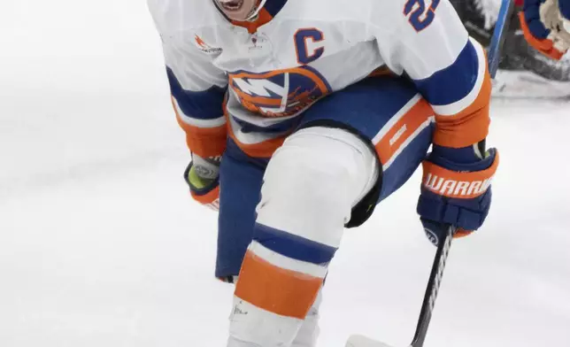 New York Islanders' Anders Lee (27) celebrates his goal against the Montreal Canadiens during the second period of an NHL hockey game in Montreal, Tuesday, Dec. 3, 2024. (Christinne Muschi/The Canadian Press via AP)