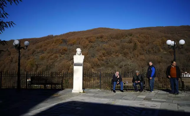 Locals gather at the main square of Fourna village, central Greece, Monday, Nov. 25, 2024. (AP Photo/Thanassis Stavrakis)