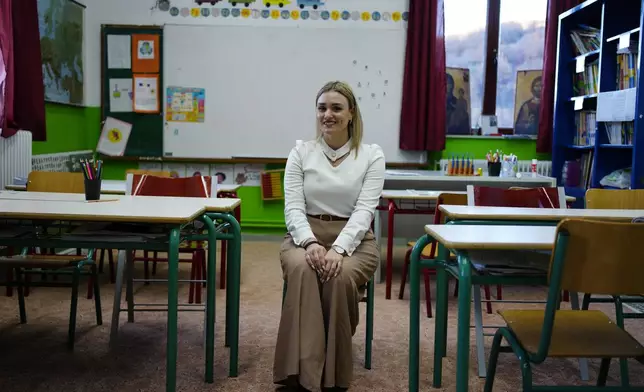 Schoolteacher Panagiota Diamanti poses for a portrait in her classroom in Fourna village, central Greece, Monday, Nov. 25, 2024. (AP Photo/Thanassis Stavrakis)