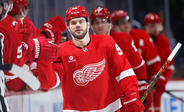 Detroit Red Wings right wing Alex DeBrincat (93) celebrates after scoring against the Philadelphia Flyers during the second period of an NHL hockey game Wednesday, Dec. 18, 2024, in Detroit. (AP Photo/Duane Burleson)