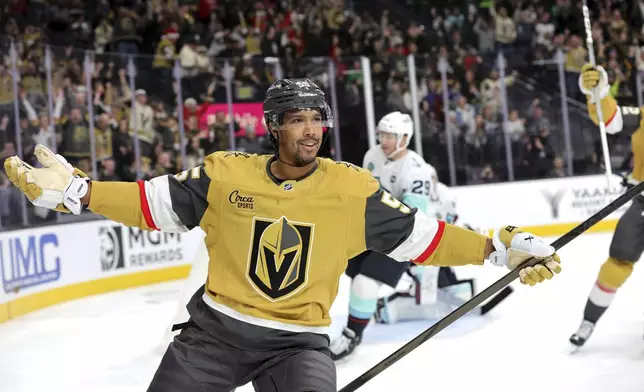 Vegas Golden Knights right wing Keegan Kolesar (55) celebrates after scoring a goal against the Seattle Kraken during the first period of an NHL hockey game, Saturday, Dec. 21, 2024, in Las Vegas. (Steve Marcus/Las Vegas Sun via AP)