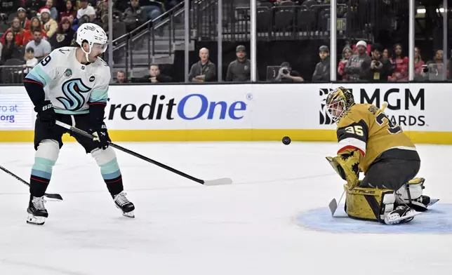 Seattle Kraken center Chandler Stephenson (9) shoots against Vegas Golden Knights goaltender Ilya Samsonov (35) during the first period of an NHL hockey game Saturday, Dec. 21, 2024, in Las Vegas. (AP Photo/David Becker)