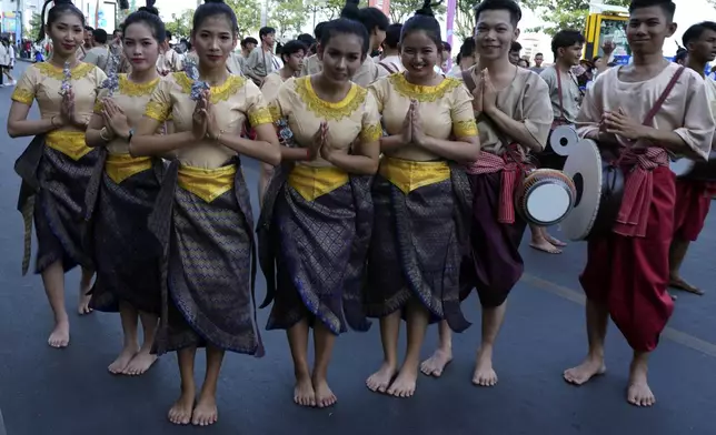 Cambodian dancers greet before performing during the "Celebrating Cambodia" event as part of the New Year's Eve in front of Royal Palace in Phnom Penh, Cambodia, Tuesday Dec. 31, 2024. (AP Photo/Heng Sinith)