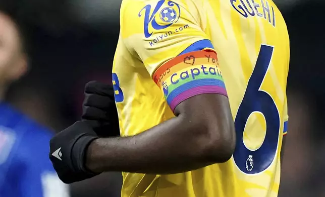 Crystal Palace's Marc Guehi wearing the Rainbow Laces captain's armband which has the words 'Jesus Heart You' on during the England Premier League soccer match between Ipswich Town and Crystal Palace at Portman Road, Ipswich, England, Tuesday, Dec. 3, 2024. (Zac Goodwin/PA via AP)