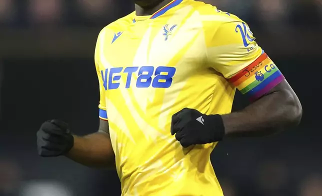 Crystal Palace's Marc Guehi wears the Rainbow Laces captain's armband which has the words 'Jesus Heart You' on during the England Premier League soccer match between Ipswich Town and Crystal Palace at Portman Road, Ipswich, England, Tuesday, Dec. 3, 2024. (Zac Goodwin/PA via AP)