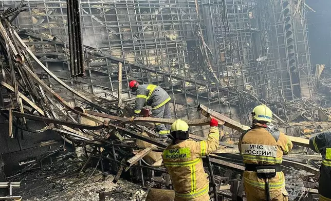 FILE - In this photo released by the Russian Emergency Ministry Press Service, rescuers work at Crocus City Hall on the western edge of Moscow, on March 23, 2024, following an attack. (Russian Emergency Ministry Press Service via AP, File)