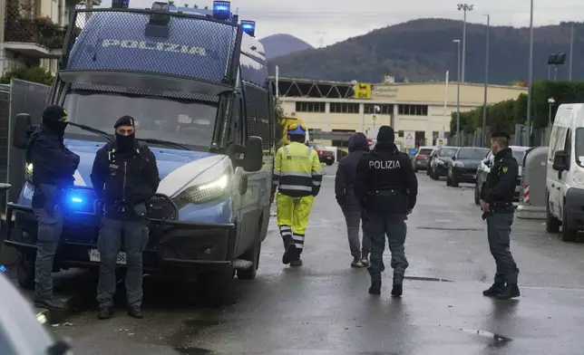 Police work on a site of a fuel depot's explosion in Calenzano, near Florence, Italy, Monday, Dec. 9, 2024. (Alessandro La Rocca/LaPresse via AP)