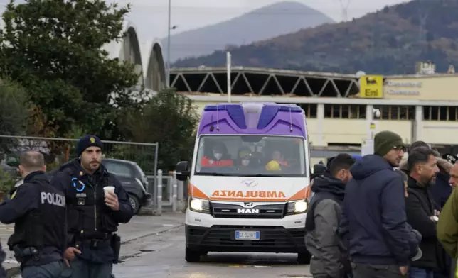 Emergency services work on a site of a fuel depot's explosion in Calenzano, near Florence, Italy, Monday, Dec. 9, 2024. (Alessandro La Rocca/LaPresse via AP)