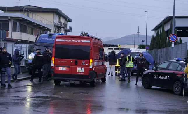 Emergency services work on a site of a fuel depot's explosion in Calenzano, near Florence, Italy, Monday, Dec. 9, 2024. (Alessandro La Rocca/LaPresse via AP)