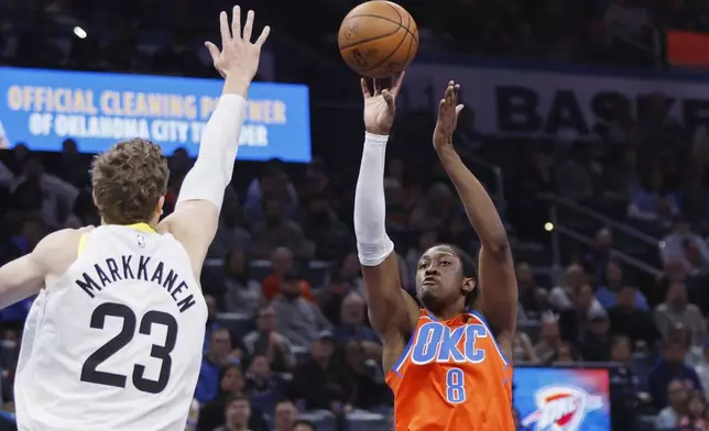 Oklahoma City Thunder forward Jalen Williams (8) shoots against Utah Jazz forward Lauri Markkanen (23) during the first half of an Emirates NBA Cup basketball game, Tuesday, Dec. 3, 2024, in Oklahoma City. (AP Photo/Nate Billings)