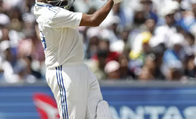 India's Ravichandran Ashwin plays a shot to be caught behind by Australia's wicketkeeper Alex Carey during the day three of the second cricket test match between Australia and India at the Adelaide Oval in Adelaide, Australia, Sunday, Dec. 8, 2024. (AP Photo/James Elsby)