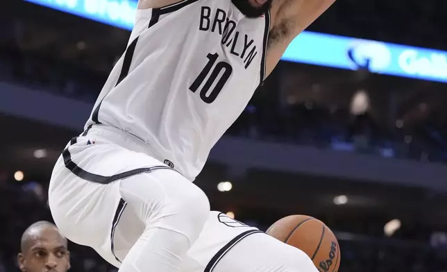 Brooklyn Nets' Ben Simmons dunks during the first half of an NBA basketball game Thursday, Dec. 26, 2024, in Milwaukee. (AP Photo/Morry Gash)