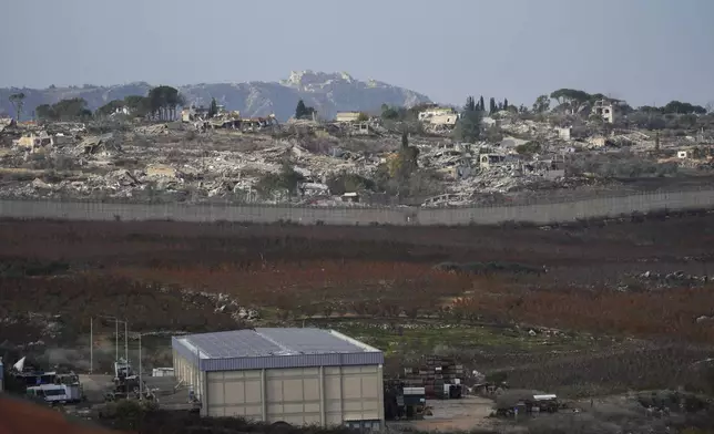 Parts of the southern Lebanese town of Kfar Kila are seen flattened by bombardments from Metula, Israel's northernmost town, on Wednesday, December 4, 2024. (AP Photo/Ohad Zwigenberg)