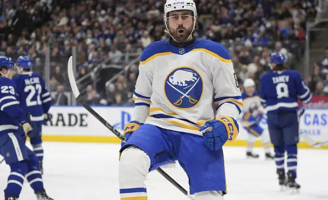 Buffalo Sabres forward Alex Tuch (89) celebrates a goal against the Toronto Maple Leafs during the first period of an NHL hockey game in Toronto, Sunday, Dec. 15, 2024. (Frank Gunn/The Canadian Press via AP)