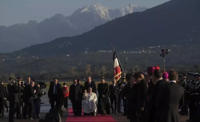 Pope Francis arrives at Ajaccio International Airport on the occasion of his one-day visit in the French island of Corsica, Sunday, Dec. 15, 2024. (AP Photo/Alessandra Tarantino)