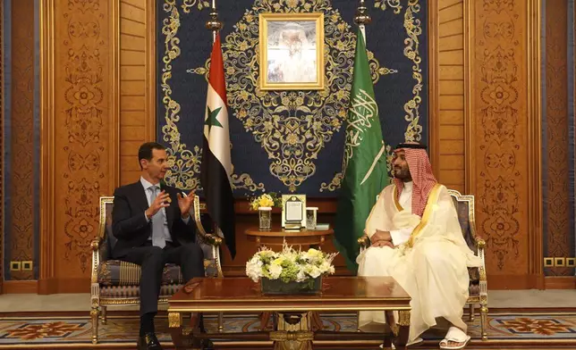 FILE - In this photo released by the Syrian official news agency SANA, shows Syrian President Bashar Assad, left, meets with Saudi Crown Prince Mohammed bin Salman, during the Arab summit in Jeddah, Saudi Arabia, May 19, 2023. (SANA via AP, File)