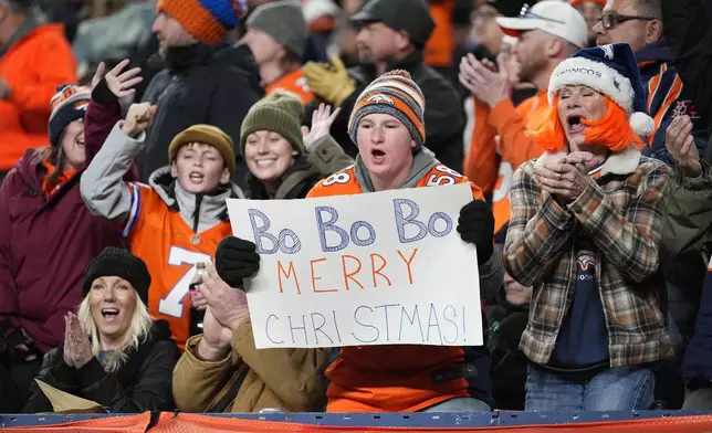 Denver Broncos fans cheer for quarterback Bo Nix during the first half of an NFL football game against the Cleveland Browns, Monday, Dec. 2, 2024, in Denver. (AP Photo/Jack Dempsey)