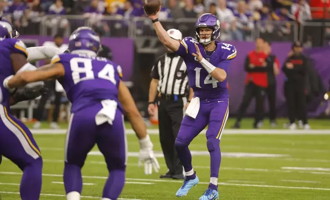 Minnesota Vikings quarterback Sam Darnold (14) throws a pass during the second half of an NFL football game against the Atlanta Falcons, Sunday, Dec. 8, 2024, in Minneapolis. (AP Photo/Bruce Kluckhohn)