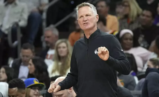 Golden State Warriors head coach Steve Kerr reacts to a foul call during the first half of an NBA basketball game against the Phoenix Suns, Saturday, Nov. 30, 2024, in Phoenix. (AP Photo/Rick Scuteri)