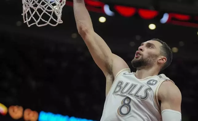 Chicago Bulls guard Zach LaVine makes a basket during the second half of an NBA basketball game against the Milwaukee Bucks, Saturday, Dec. 28, 2024, in Chicago. (AP Photo/Erin Hooley)