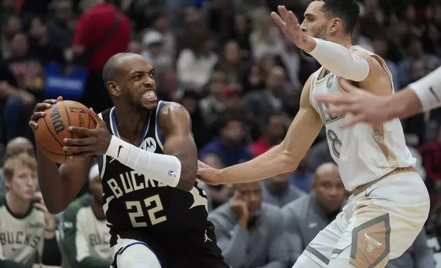 Chicago Bulls guard Zach LaVine, right, guards Milwaukee Bucks forward Khris Middleton during the first half of an NBA basketball game Saturday, Dec. 28, 2024, in Chicago. (AP Photo/Erin Hooley)